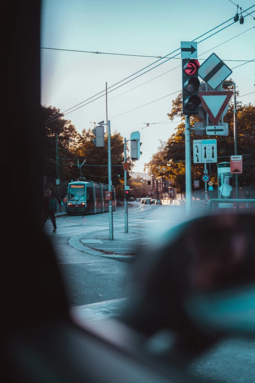 view of traffic lights and signs at a street corner