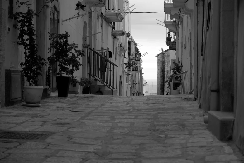 a long, narrow walkway in an old city