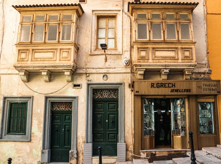 an old building in italy has windows and shutters