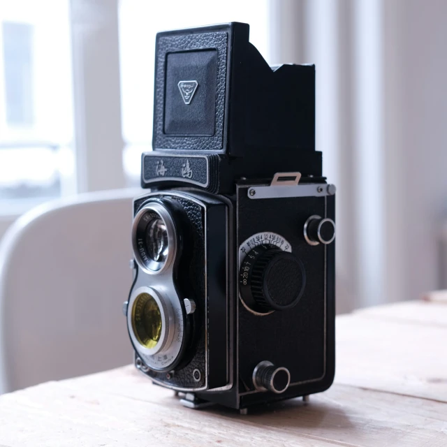 a camera sitting on top of a wooden table