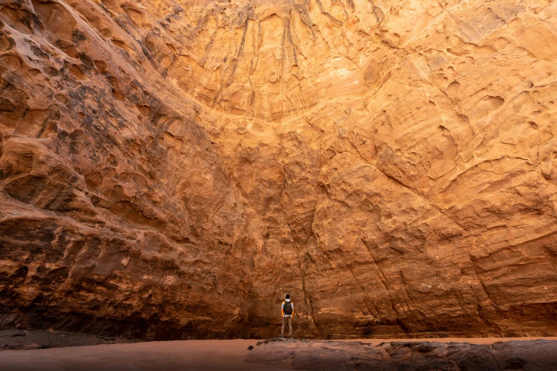 two people standing on the side of a cliff