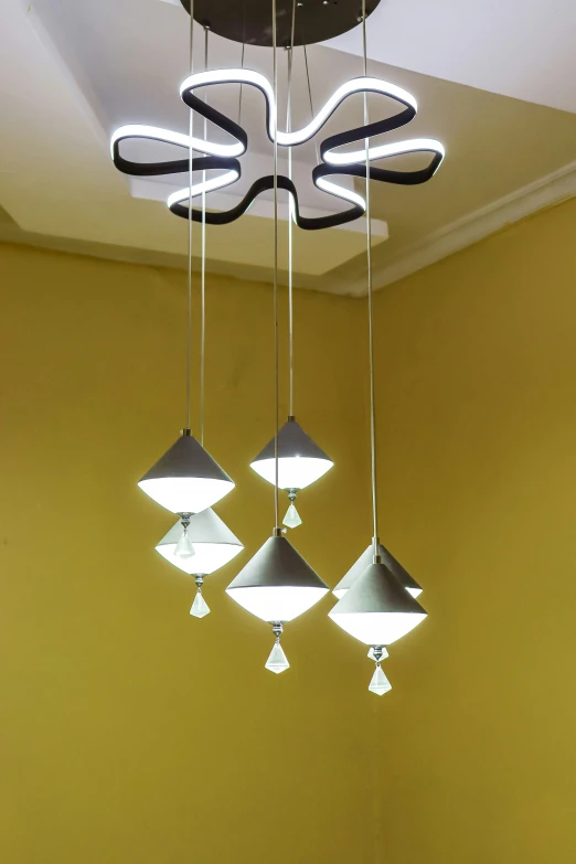 four lights with three different angles hanging from the ceiling