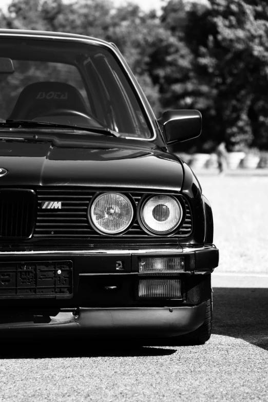 a black car parked on the side of a road