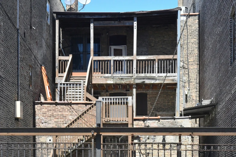 some stairs outside of an old brick building