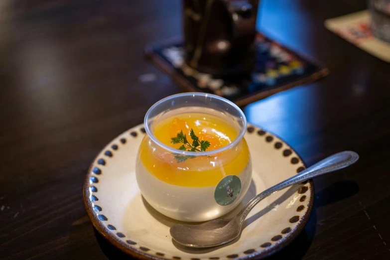 a plate with spoons and a small cup