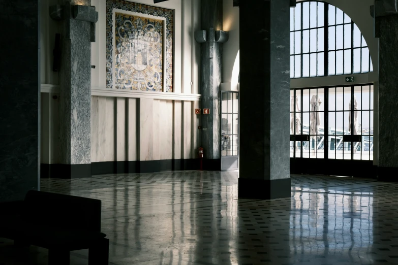 inside of a large church showing the stained glass and metal window frames