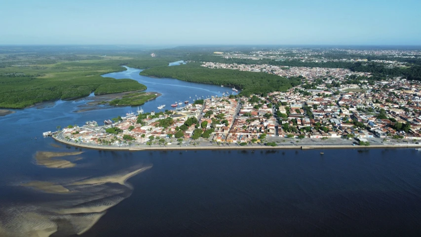 an aerial view of a city next to the water