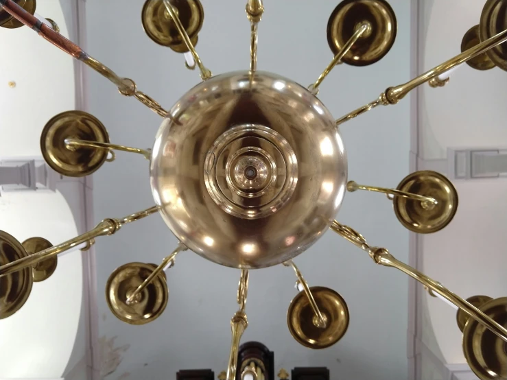 a circular lamp fixture hangs from the ceiling