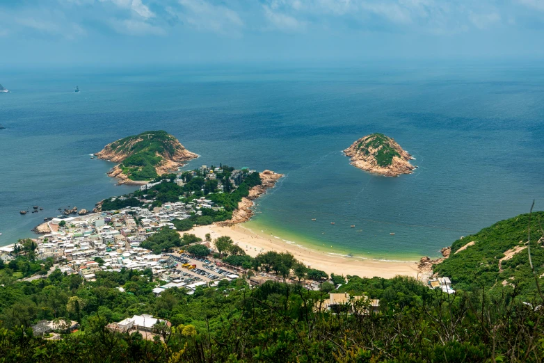 a view from a mountain of a town and water