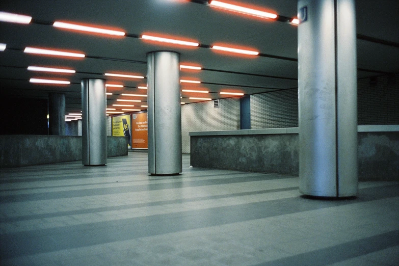 two pillars are standing next to a concrete walkway