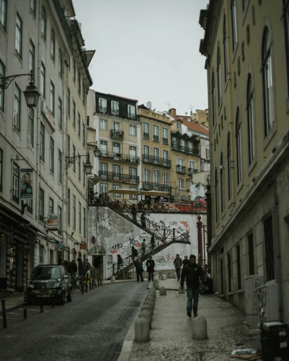 people walking down the street on a rainy day