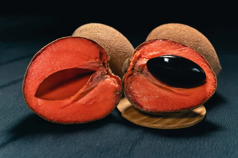 a brown piece of fruit sitting on a wooden stand