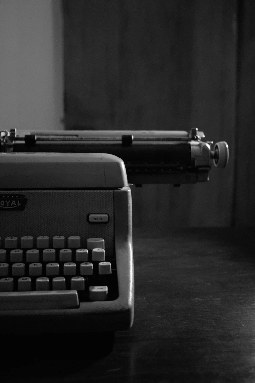 a black and white po of a typewriter on a counter