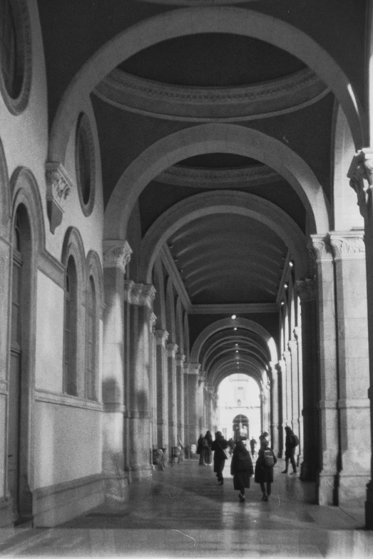 black and white po of a walkway inside a building