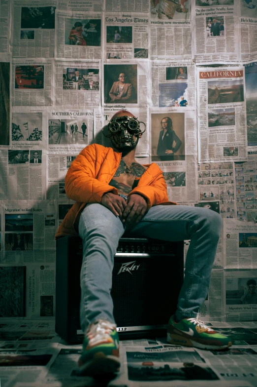 man in yellow coat sitting on top of a radio