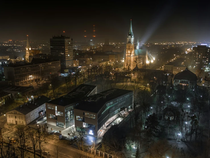 a city with buildings and lights on at night