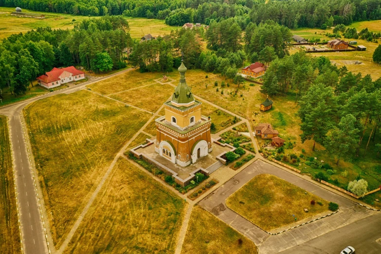 an old church and grounds in the middle of the field