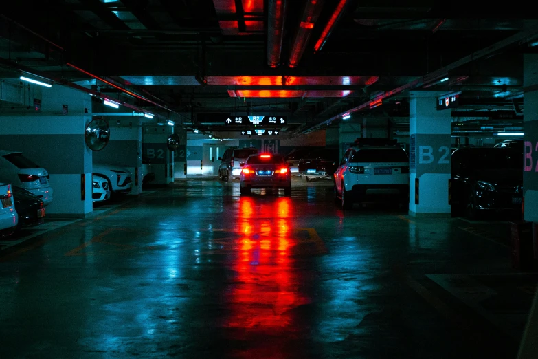 an empty parking garage is shown with a light on