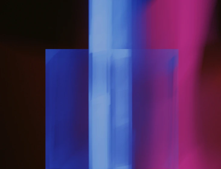 blue and pink lines are shown against a red wall