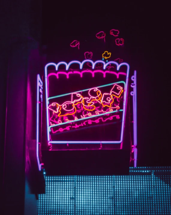 neon signs are lit up in the dark