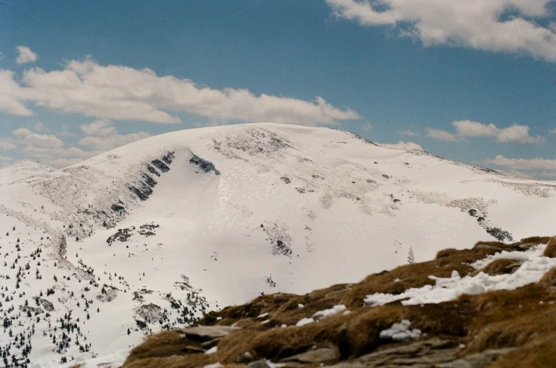 the view of a snowy mountain range is shown