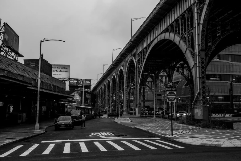 a black and white po of an old train bridge