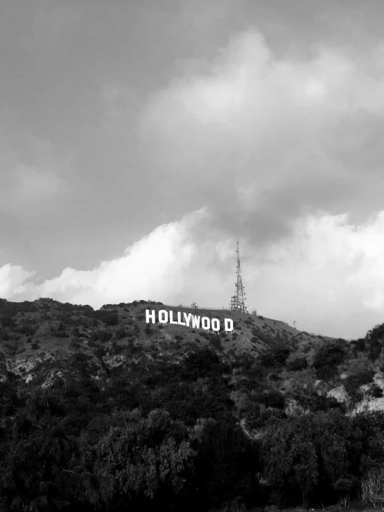 the hollywood sign is seen in front of some mountains