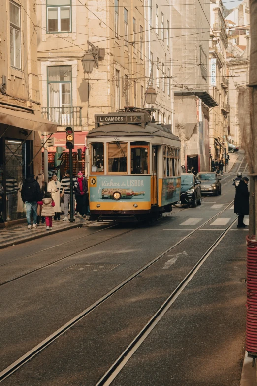 a trolley train on the tracks in the street