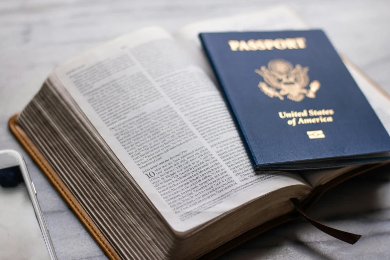 the passport is being folded up on the bed