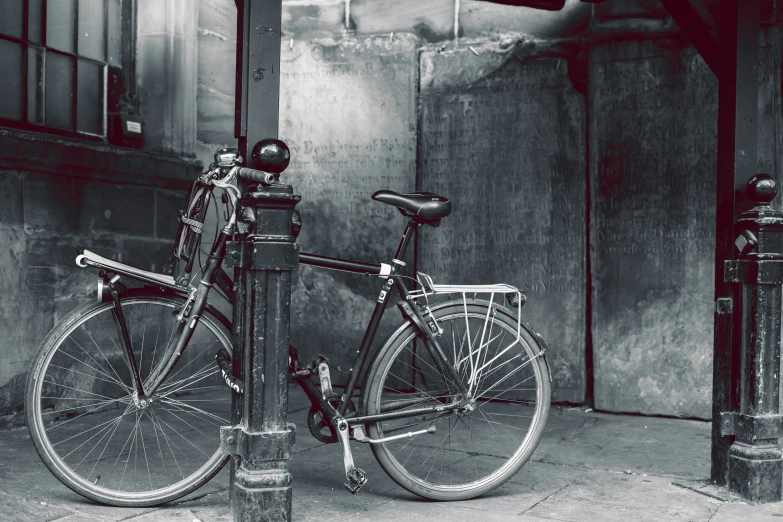 a bike sits up against a meter in a black and white po