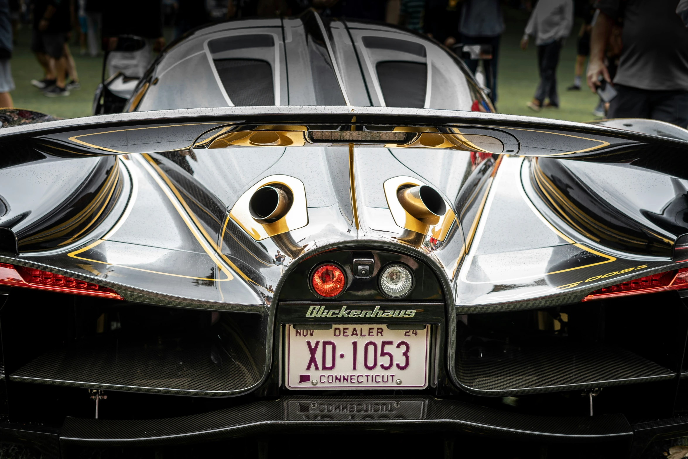 a sports car is parked at a show