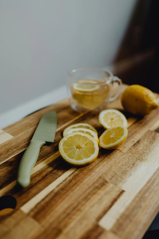 a knife rests on top of some lemon slices