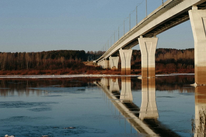 a very tall bridge sitting over a body of water