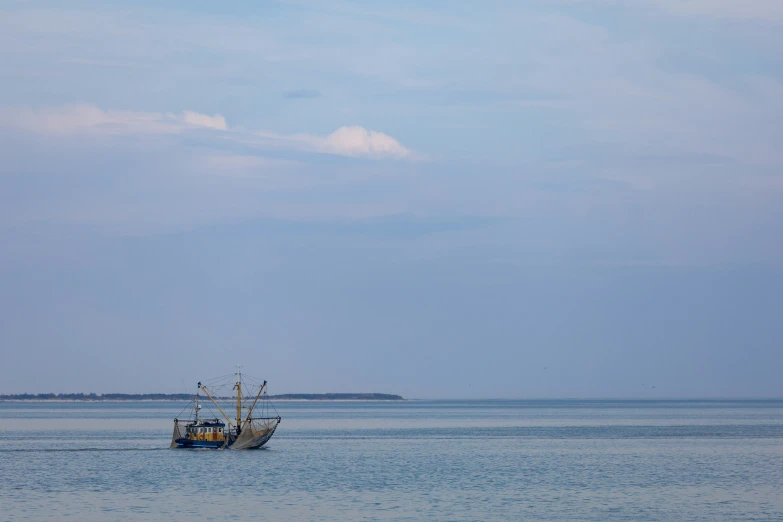 a small boat traveling across a large body of water