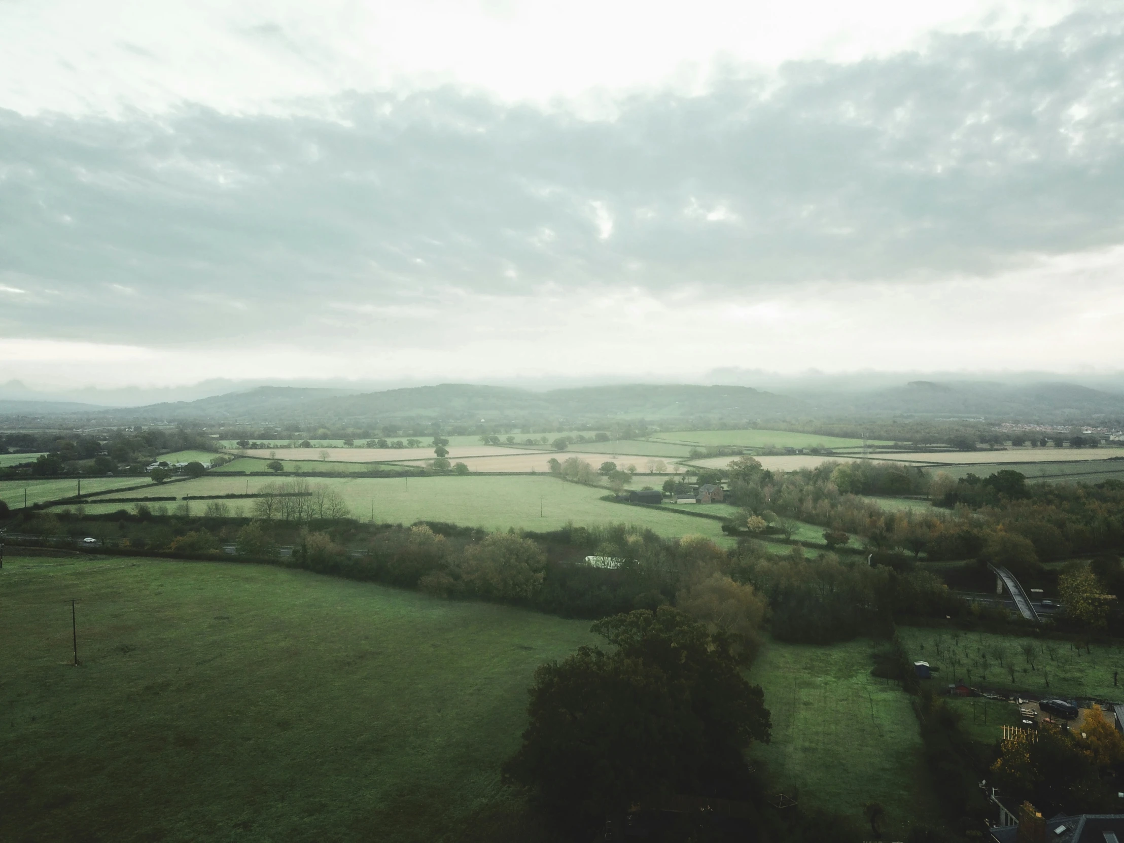 an aerial view of the countryside with lots of green