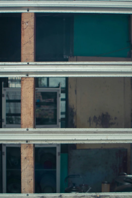 the exterior of an industrial building is covered with wood and exposed pipes