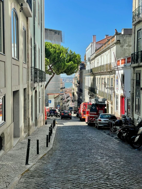 a cobble stone road near a few buildings