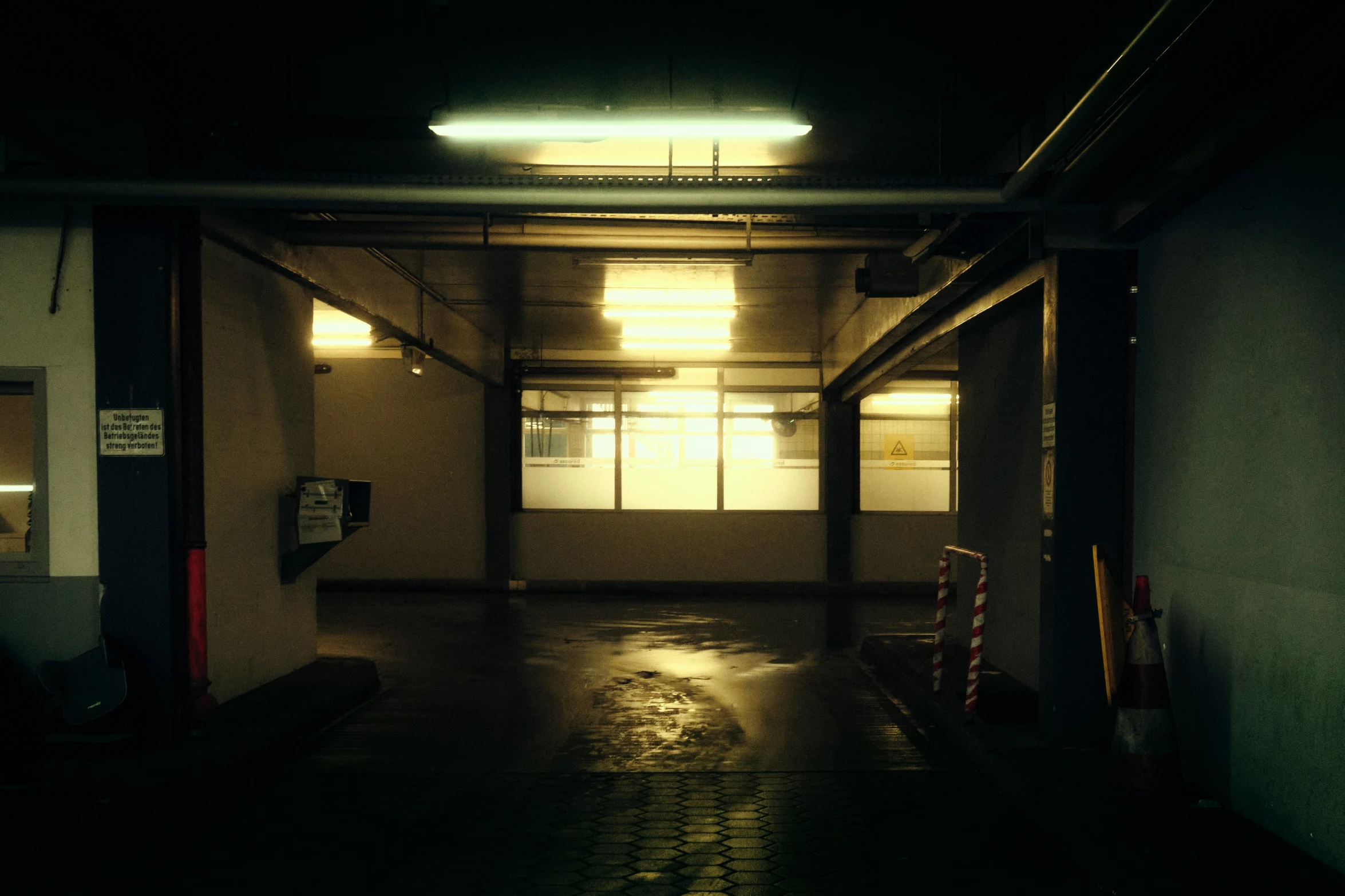 a empty building that is dimly lit in the dark