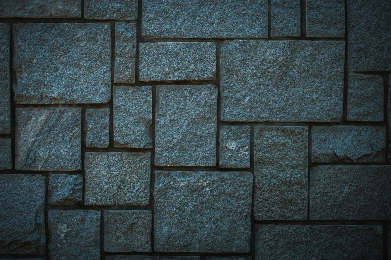 a background image with dark colors with grey stones