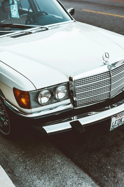 an old mercedes benz on the street