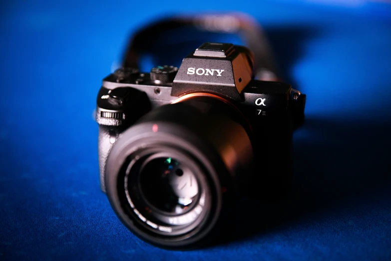 a small camera sitting on top of a blue table