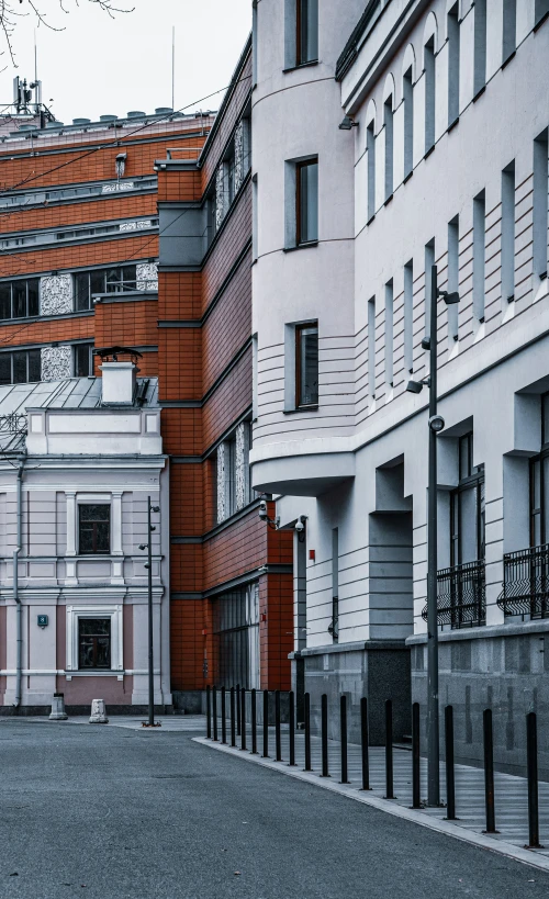 the view from outside of a city street with some buildings