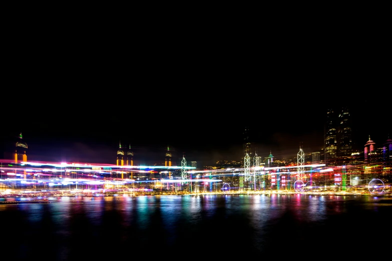 a night scene with a city lit up with colorful lights