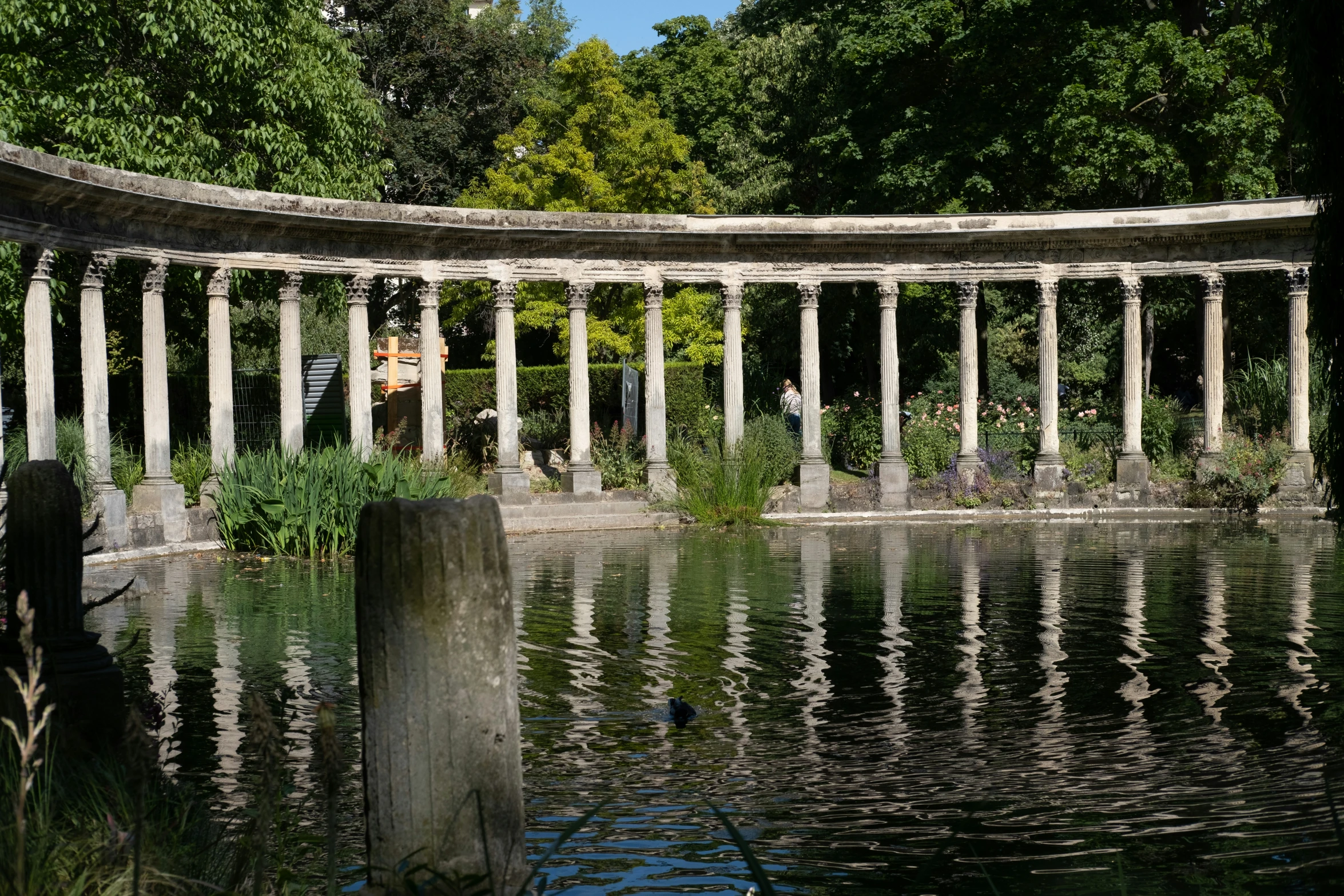 the architecture of an old stone building is reflected in the water