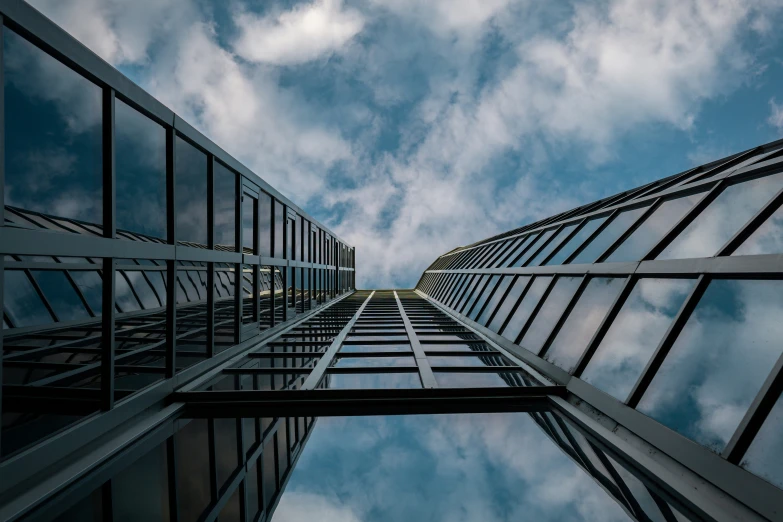 a tall building sitting under a cloudy sky