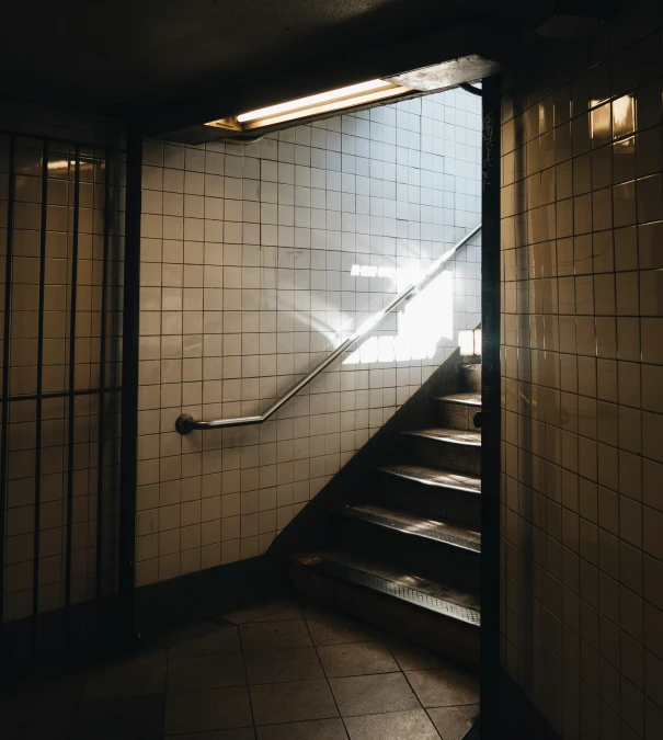 the light shines on the stairs while sunlight comes through