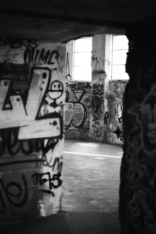 some graffiti is on the walls of a large building