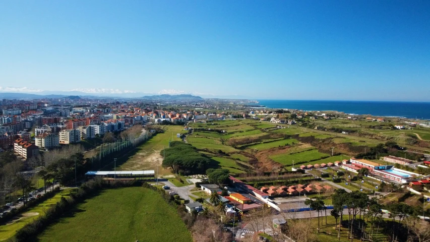 a city overlooking the ocean next to the sea