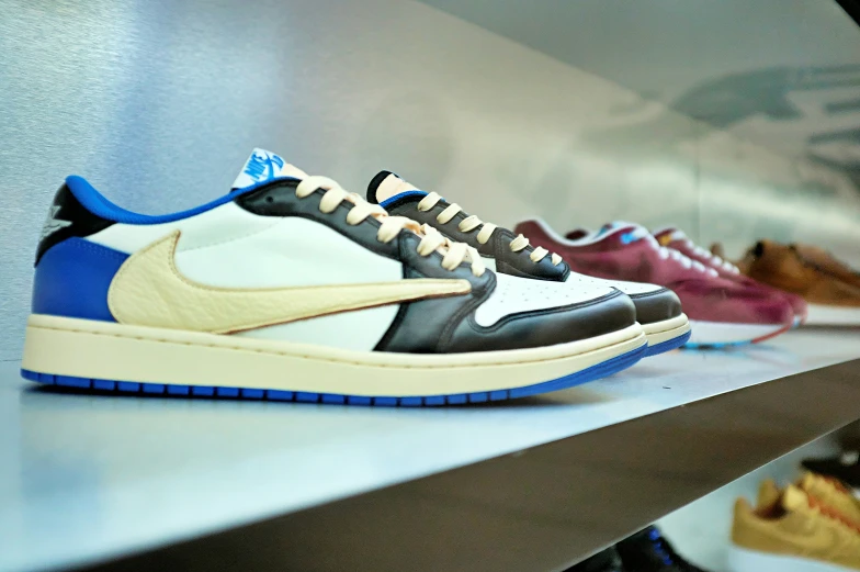 an assortment of different colored sneakers on display