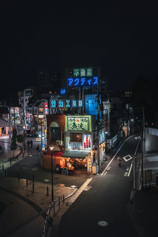 night s of asian building with neon signs on it